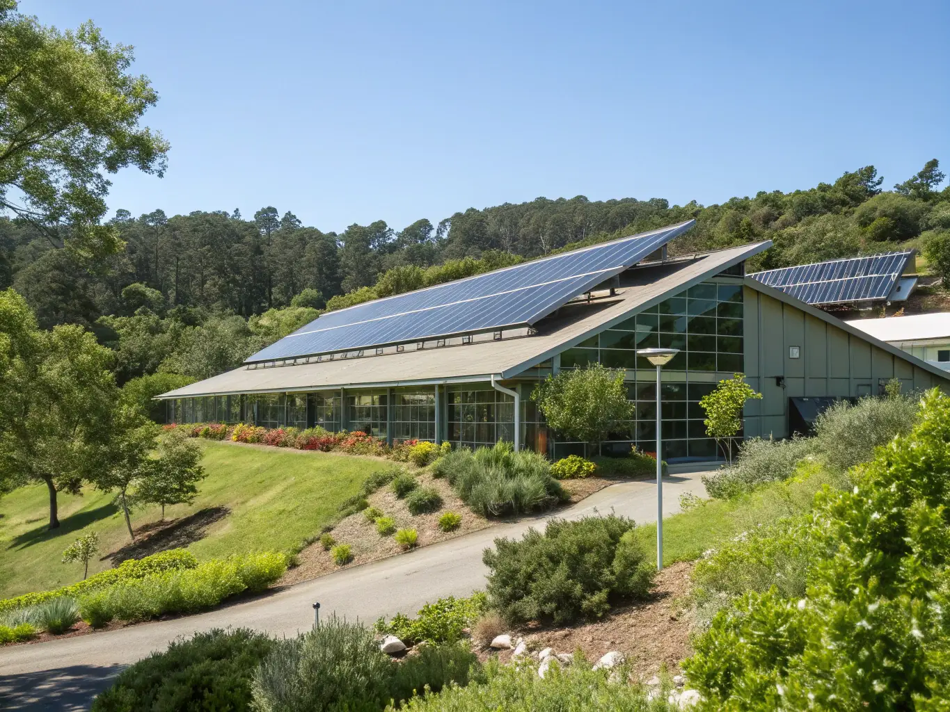 A modern building with solar panels and wind turbines, illustrating sustainable energy practices and environmental responsibility.